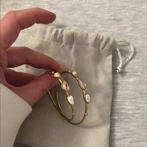 Elegant Gold and Pearl Bangle Bracelet